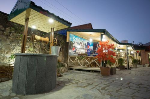 a building with a trash can in front of it at Hotel Dimasi in Kutaisi