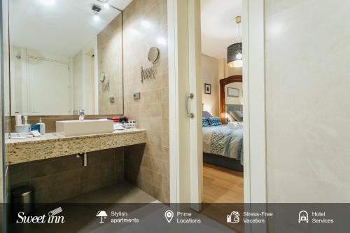 Kylpyhuone majoituspaikassa Alameda de Hercules Apartment