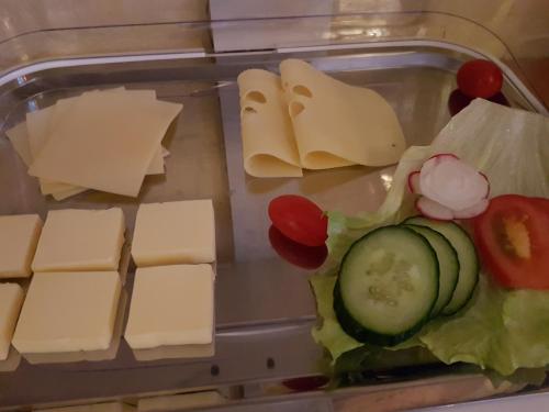 a plastic container filled with cheese and vegetables at Hotel Alte Post in Bad Sooden-Allendorf