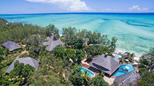 an aerial view of a resort and the ocean at Tulia Zanzibar Unique Beach Resort in Pongwe