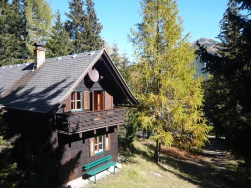 a small house in the middle of a forest at Waldnerhütte in Hermagor