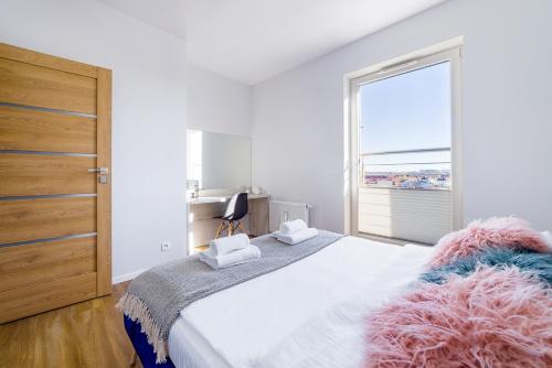 Posteľ alebo postele v izbe v ubytovaní Apartament Olsztyński - Lake Apartments, osiedle Calamo Park - Olsztyn