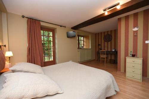 Postel nebo postele na pokoji v ubytování La Corrérie