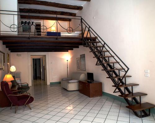 a living room with a spiral staircase in a room at Home47 in Salerno