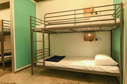 a couple of bunk beds in a room at SHA LA LA in Kuala Lumpur