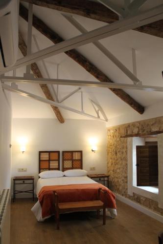 A bed or beds in a room at El Retiro del Pilar