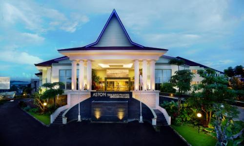a building with a clock on the front of it at Aston Tanjung Pinang Hotel & Conference Center in Tanjung Pinang 