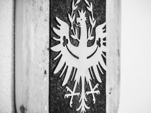 a black and white picture of a symbol on a flag at Hanserhof in Zell am Ziller
