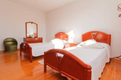Ένα ή περισσότερα κρεβάτια σε δωμάτιο στο Casa Bahía Santander