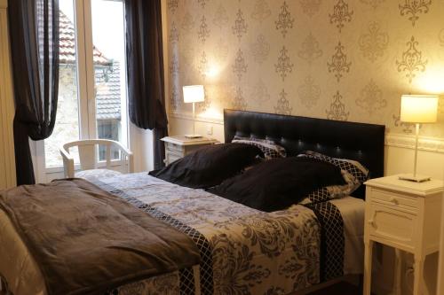 Domaine La Garence tesisinde bir odada yatak veya yataklar
