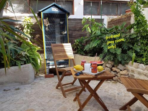 a table with a tray of fruit and drinks on it at Faro Town House in Faro