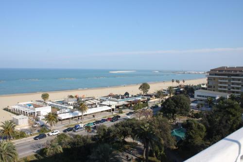 a view of a beach with a resort and the ocean at Hotel Esplanade in Pescara