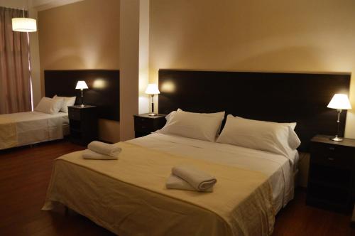 Cama ou camas em um quarto em 770Hotel