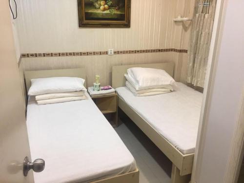 Postel nebo postele na pokoji v ubytování Aries Guest House
