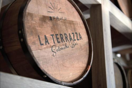 a barrel of wine sitting on a shelf at HOTEL MYSTAYS Matsuyama in Matsuyama