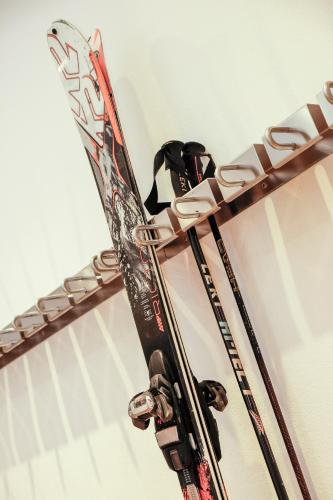 a pair of skis are on a rack at Hotel Alpspitz B&B in Grainau