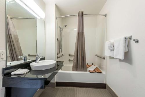 a bathroom with a sink and a shower at Studio 6-Monroe, LA - Hwy 165 in Monroe