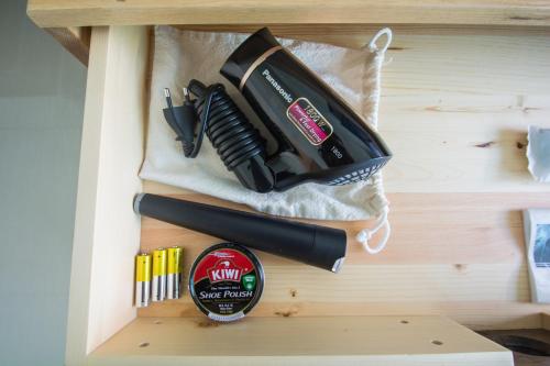 a drawer with a knife and other kitchen utensils at Good Night Pool Villa Phuket - SHA Plus in Phuket Town