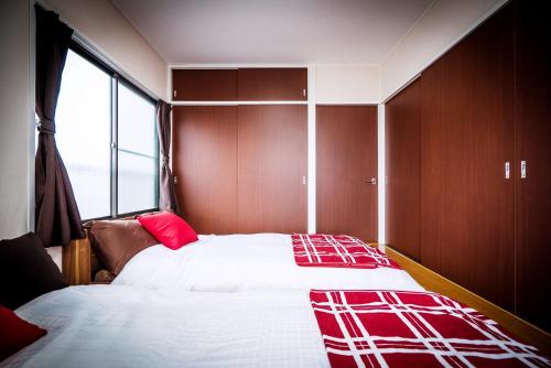 Un pat sau paturi într-o cameră la Murata Corpo 305