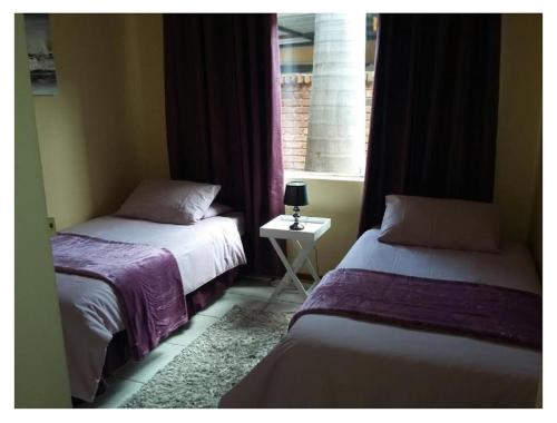 Katil atau katil-katil dalam bilik di Lala Bela Guest House