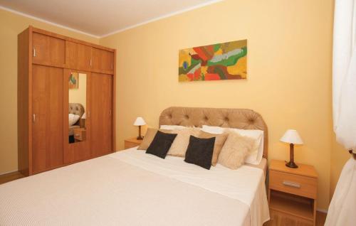 Postel nebo postele na pokoji v ubytování Apartman Čižići 97 a