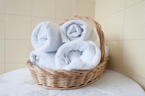 a basket filled with towels on a table at Riverina hotel in Holbrook