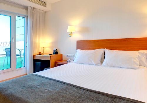 Postel nebo postele na pokoji v ubytování Hotel Ultonia