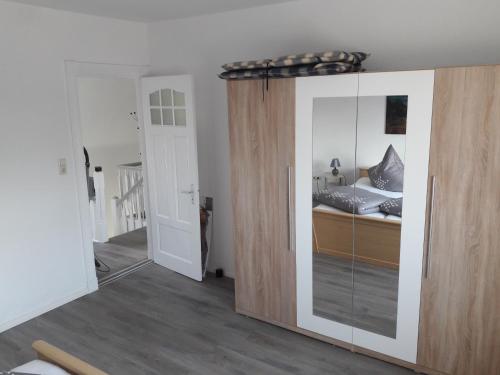 a bedroom with a bed and a sliding glass door at Stefanie in Heide