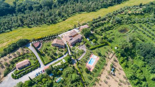 an aerial view of a house on a hill at Borgo Di Collelungo in Montaione