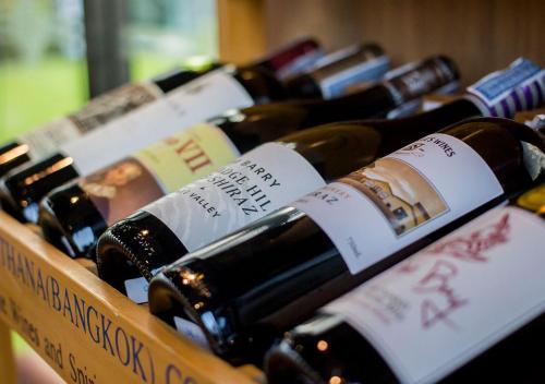 a bunch of bottles of wine in a box at Green Pix Khaoyai in Pak Chong