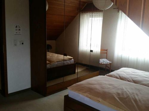 Ένα ή περισσότερα κρεβάτια σε δωμάτιο στο Ferienhaus Raabe
