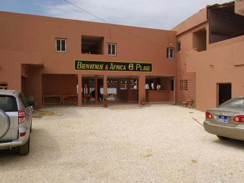 a parking lot in front of a building at Africa 6 Plage in Somone