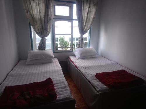 Postel nebo postele na pokoji v ubytování Diamond Star Guest House