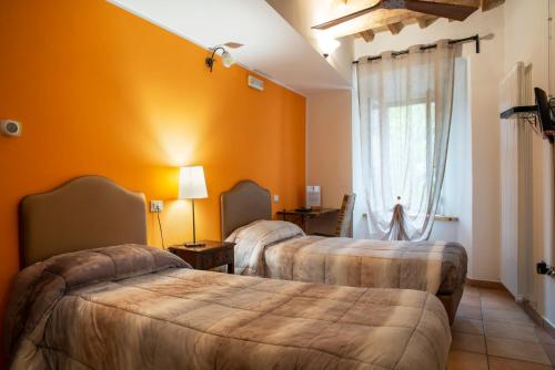 Tempat tidur dalam kamar di Porta Mazzini Affittacamere