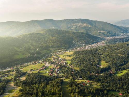 an aerial view of a town in the mountains at Mała Osada domki z jacuzzi przy gondoli in Szczyrk