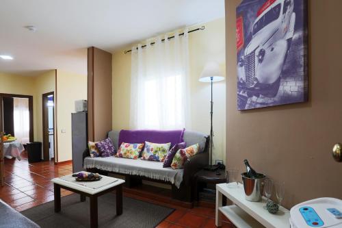 a living room with a couch and a table at Marody House Vacacional in Granadilla de Abona