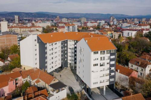 an overhead view of a large white building with an orange roof at NAR Royalton Accommodation in Niš