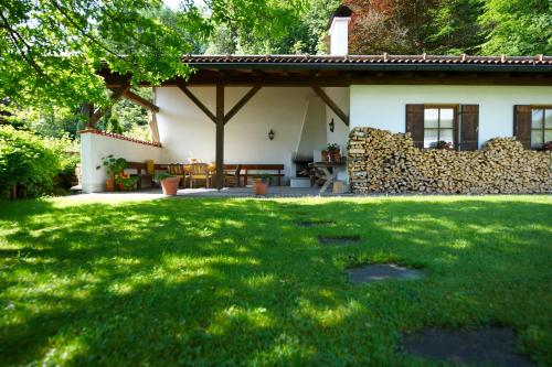 a house with a green lawn in front of it at Aktiv Hotel Schweiger in Füssen