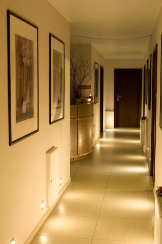 a hallway with led lights on the walls at Bagińscy Spa in Pobierowo