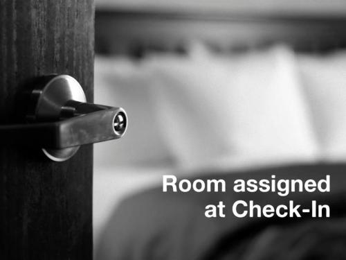 a room assigned at check in written on a wooden door at Five Rooms Rome Guesthouse in Rome