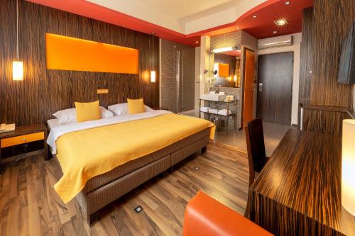 a bedroom with a large bed in a room at Hotel Continental in Brno