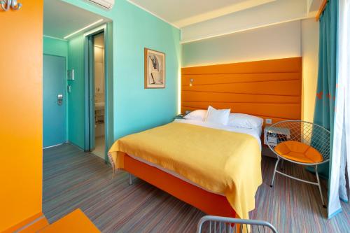 a bedroom with a bed and a desk at Hotel Continental in Brno