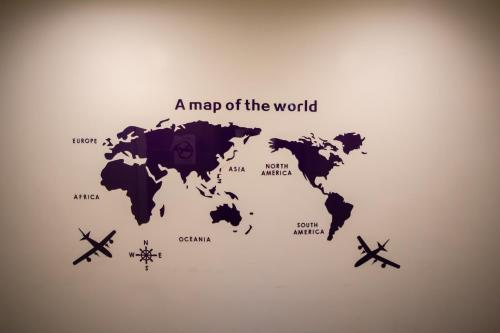 a map of the world with airplanes at Hostel Jiizu in Taipei