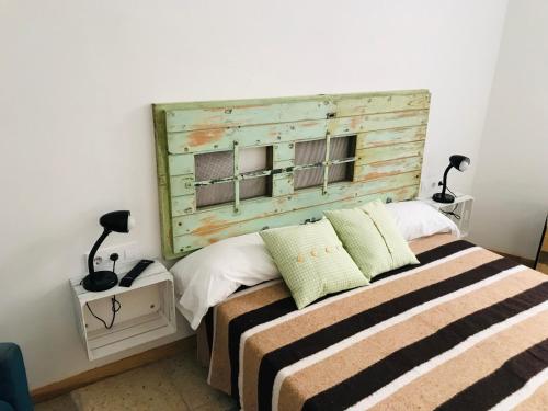 Ένα ή περισσότερα κρεβάτια σε δωμάτιο στο Mucha Masia Hostel Rural Urba