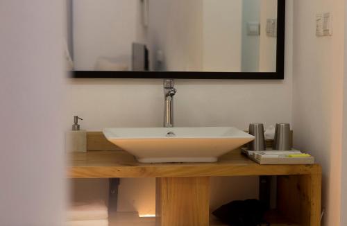 a bathroom with a white sink and a mirror at Z.Garden in Dali