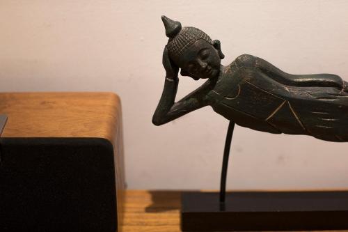 a bronze figurine of a woman on a table at Z.Garden in Dali