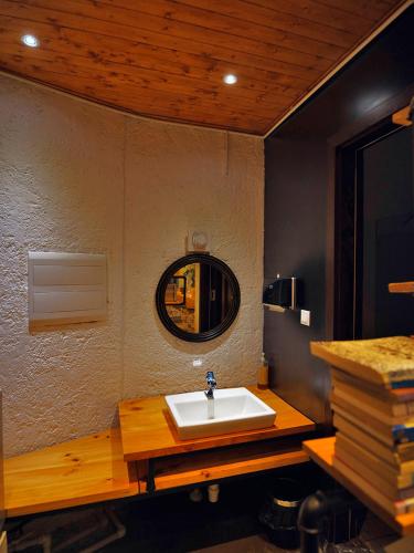 a bathroom with a sink and a mirror on the wall at Z.Garden in Dali