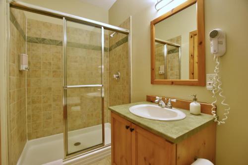 a bathroom with a sink and a shower at The Blue Escape Blue Mountain Chalet in Blue Mountains