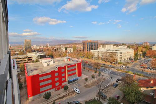 a view of a city with a red building at Luxury Skopje Apartments Premium in Skopje