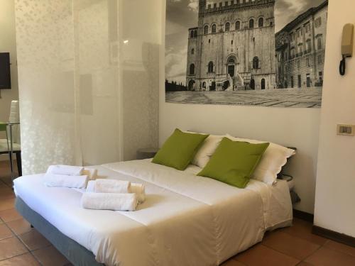 Postel nebo postele na pokoji v ubytování Happy House - Quartiere Monumentale